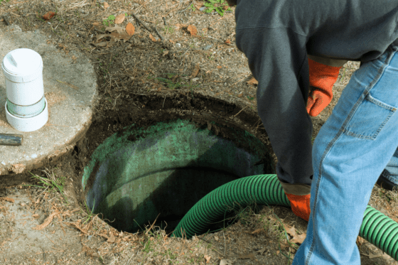 Septic tank siphoning service in progress.