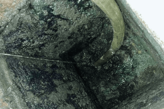 Septic tank siphoning service in progress.